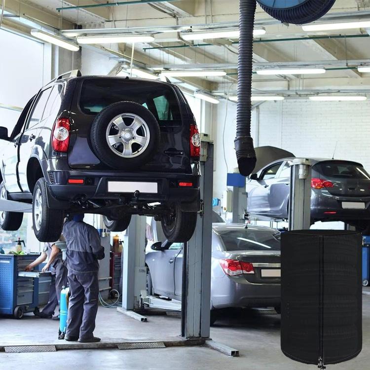 Black tire cover tarp placed over a car tire in an auto workshop setting