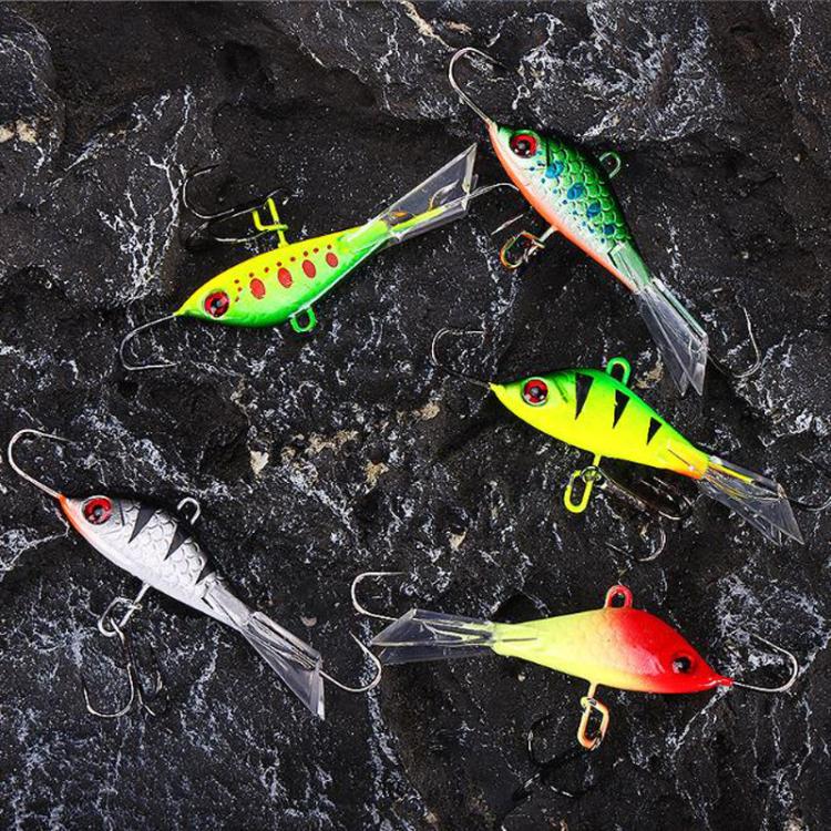 Assorted metal minnow ice fishing lures in green, yellow, red with treble hooks