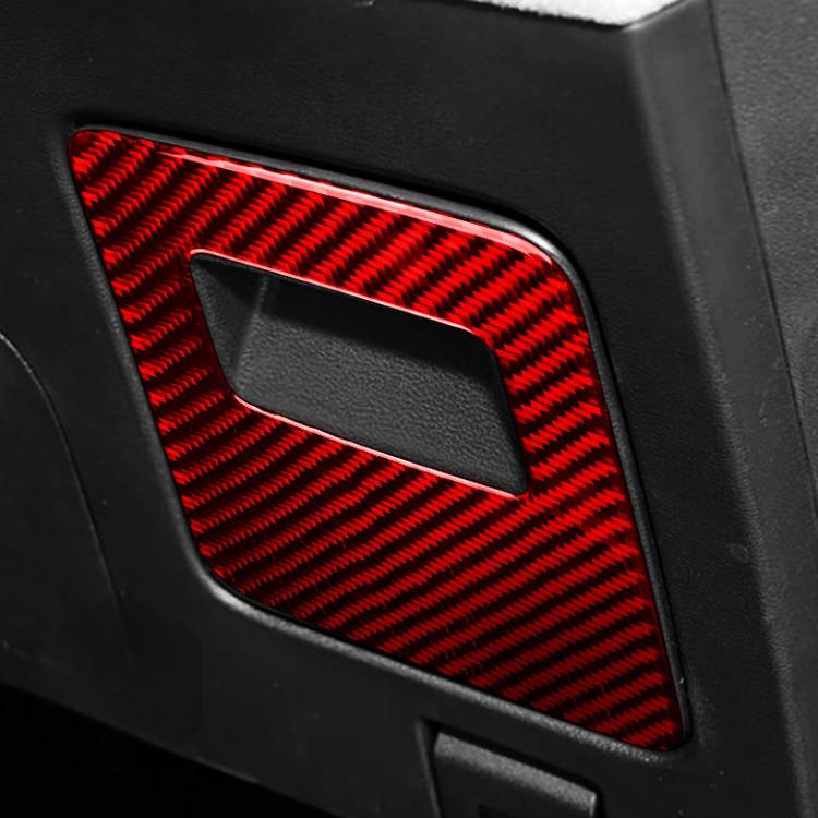Close-up of installed glove box sticker, red carbon fiber texture with cutout