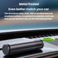 Car safety hammer stored on dashboard with black body and green pull loop