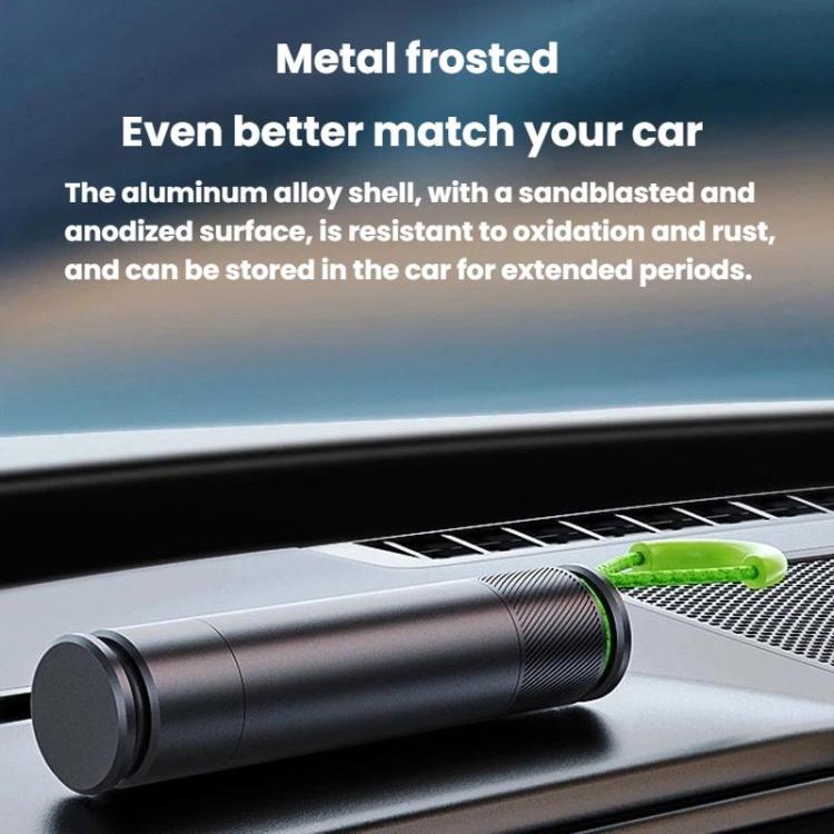 Car safety hammer stored on dashboard with black body and green pull loop