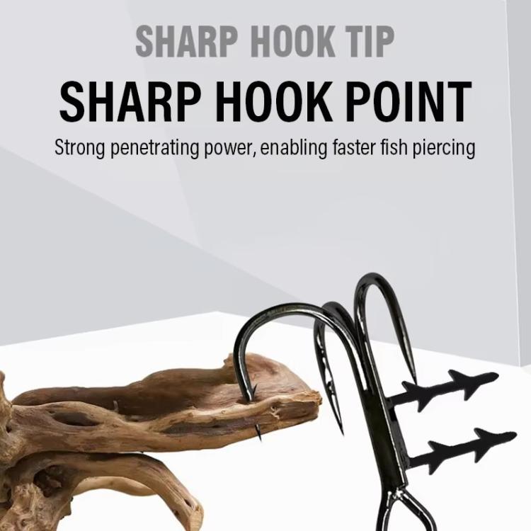 Black treble fishing hooks with sharp points and bait-holder spikes near wood bait