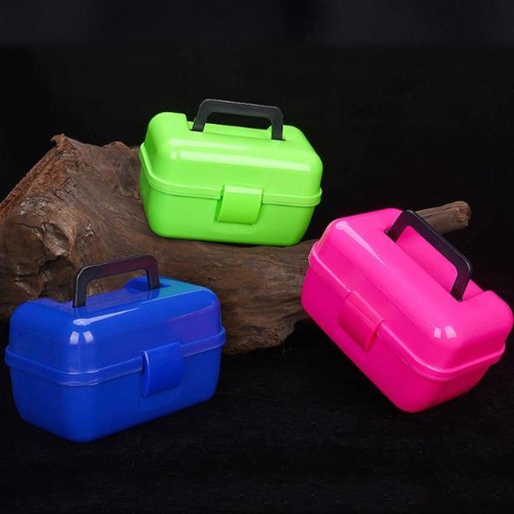 Three mini fishing tackle storage boxes in green, blue, and rose pink with handles.