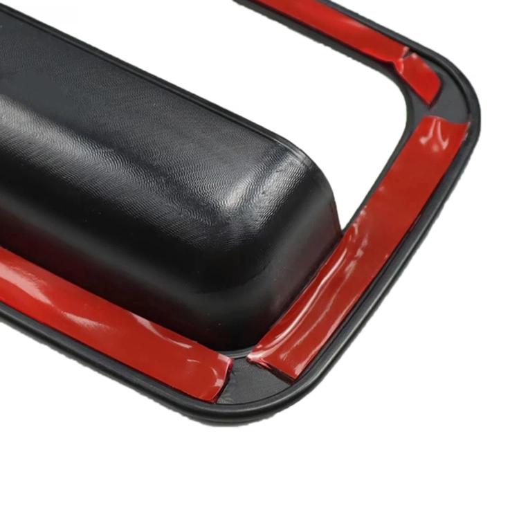 Black door handle bezel cover with rounded outer frame