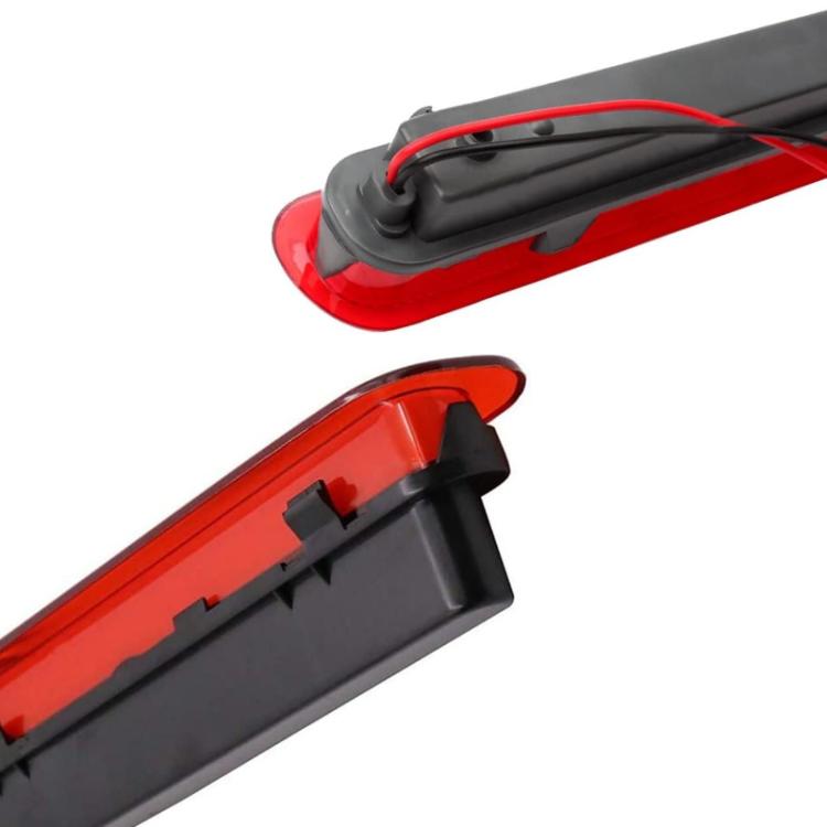 High-mounted brake light close-up with red lens and black mounting base