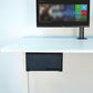 Under-desk console holder mounted under a desk, showing the front access opening