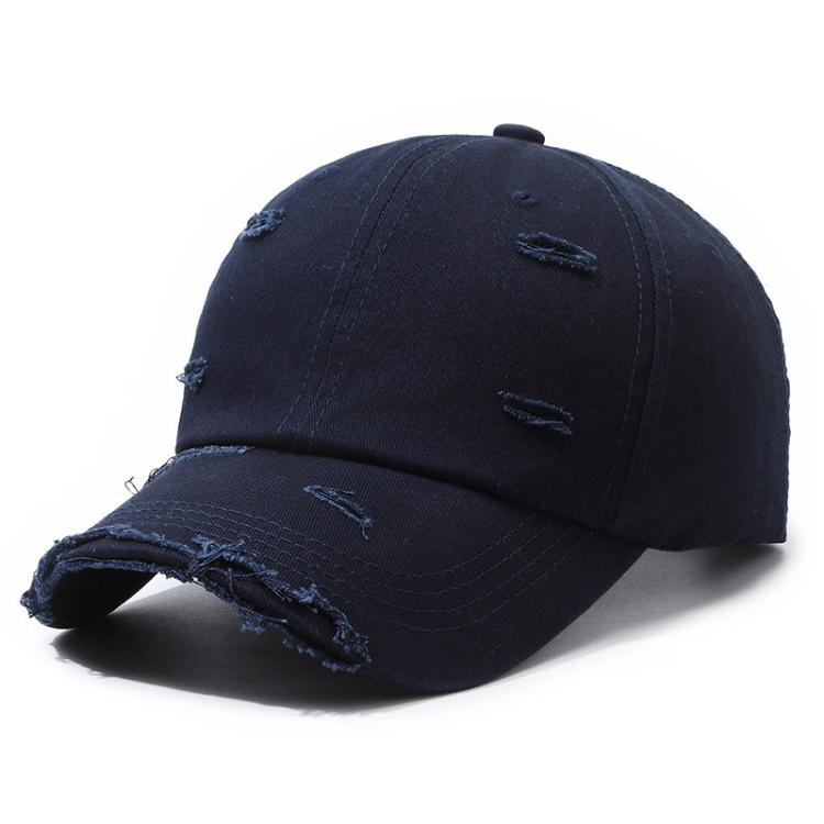 Distressed navy blue ripped baseball cap with frayed brim and patchy fabric holes