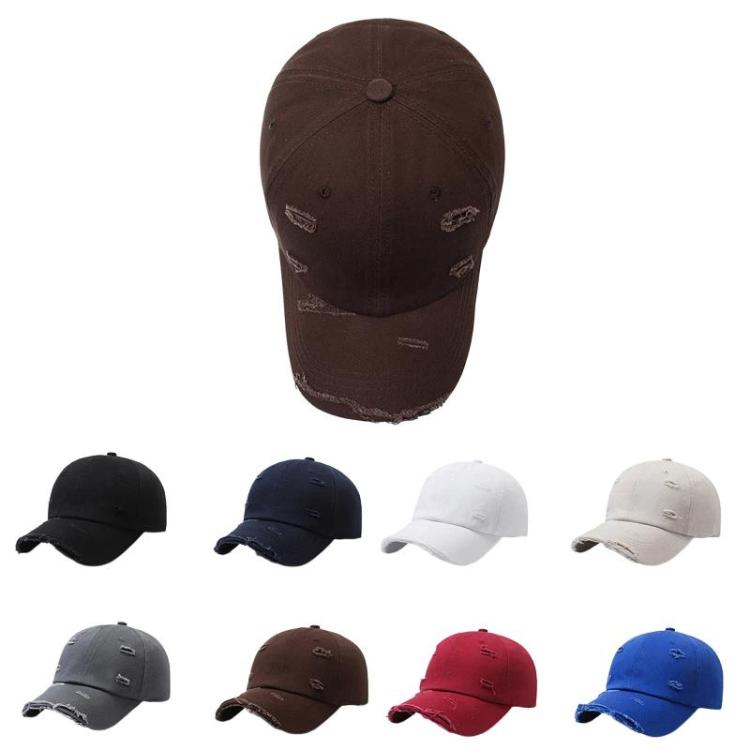 Assorted ripped distressed baseball caps in multiple colors, front views