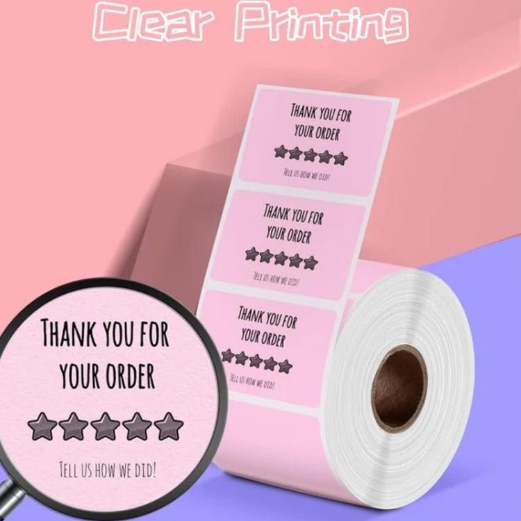 Pink adhesive labels roll with thank-you order design, clear print area