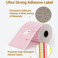 Pink thermal label roll with adhesive label sheets, close-up texture detail.