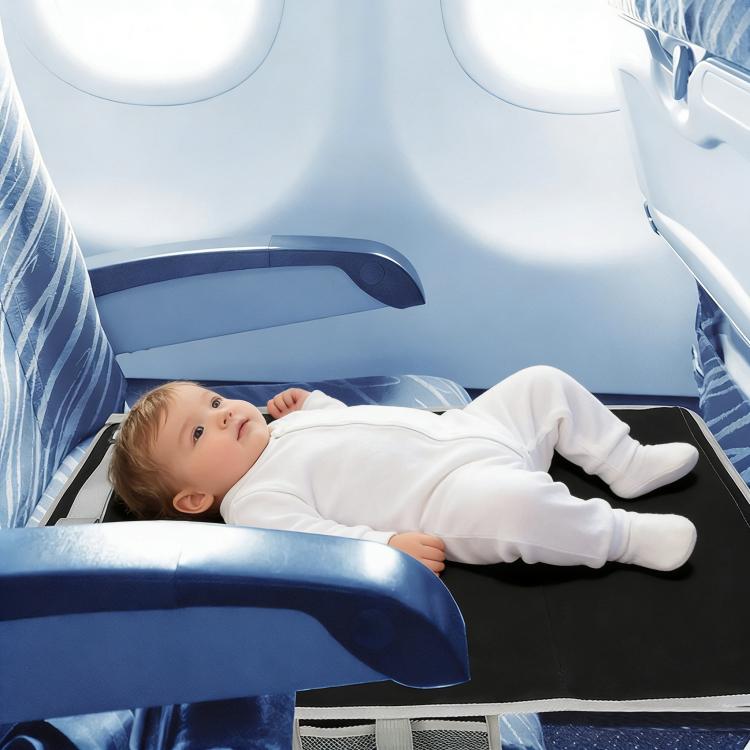 Airplane child seat extension pad in use under a seated child in a tray area