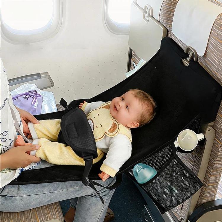 Black kids airplane seat hammock in airplane seat with baby lying inside and front strap