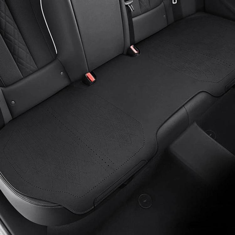 Car seat cushion in dark gray fabric on rear seat, stitched edges and perforated pattern
