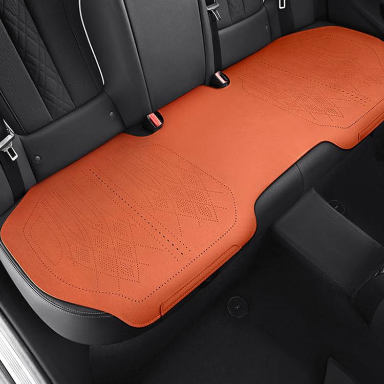 Car seat cushion in orange fabric on rear seat, stitched edges and perforated pattern