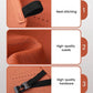 Orange suede cushion close-up with breathable holes, neat stitching, and black strap