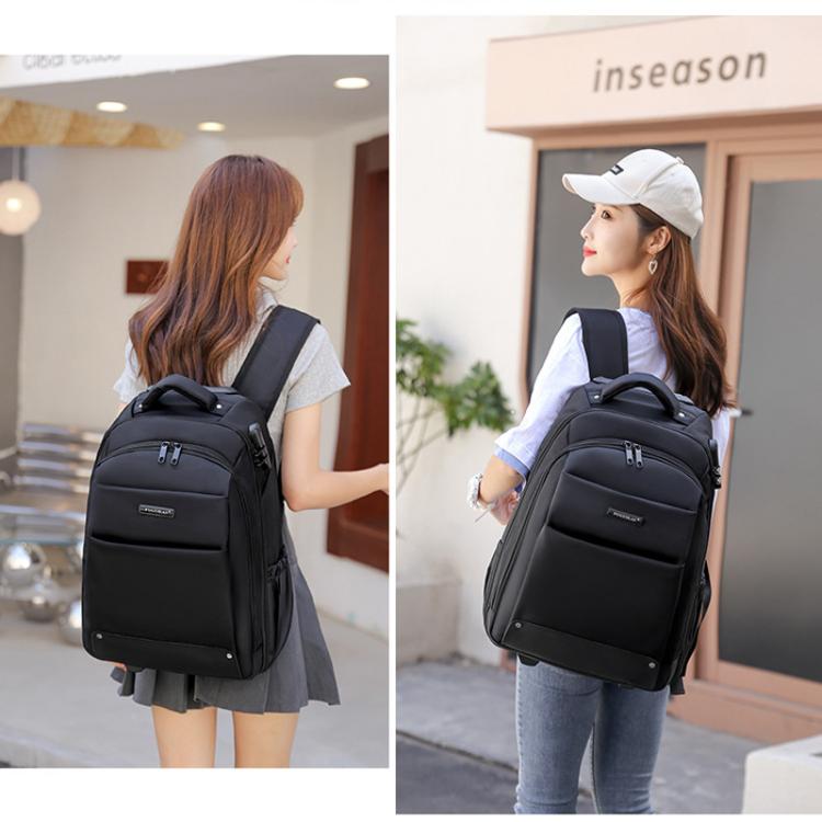 Black wheeled backpack with shoulder straps and hideable wheels, worn outdoors