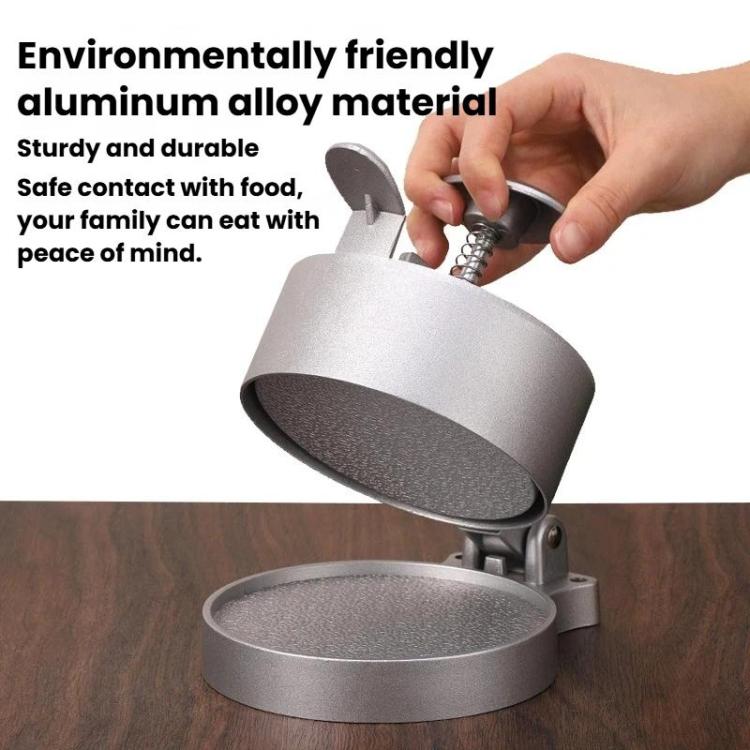 Silver manual meat patty press with hinged flip cover open and spring plunger
