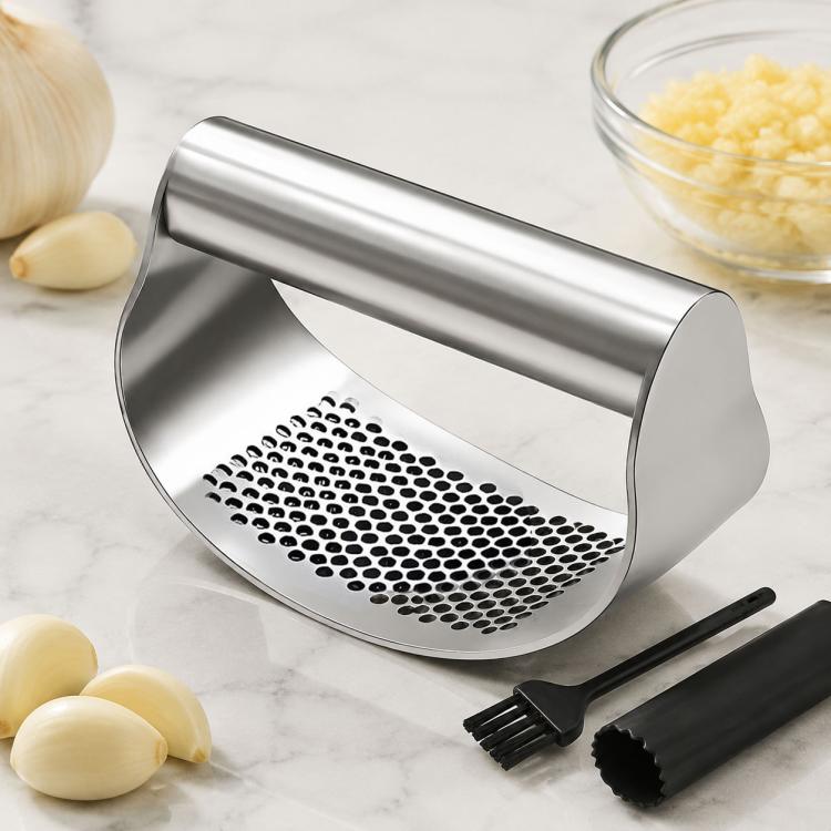 Stainless steel curved garlic press with perforated plate and black garlic peeler tool