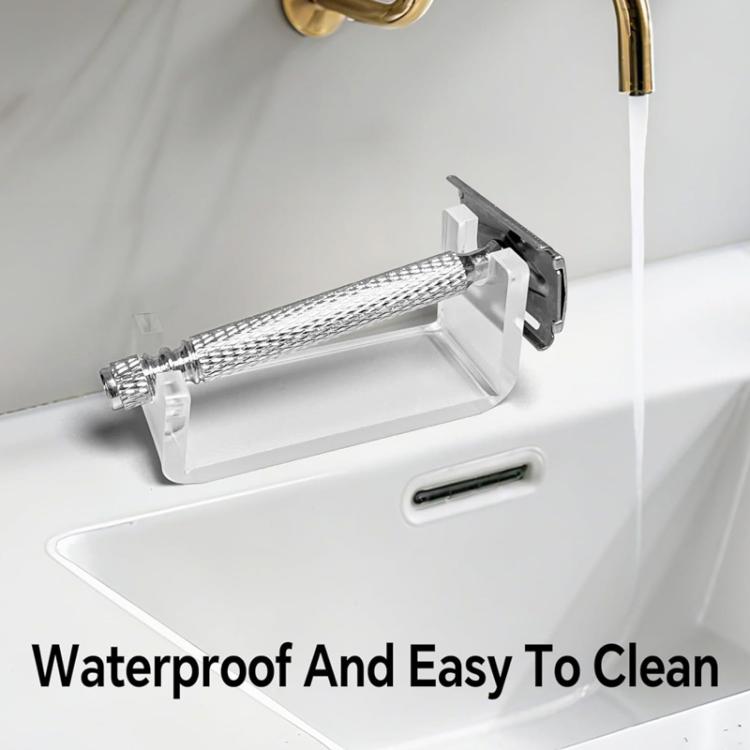 Acrylic shaver holder on bathroom sink countertop with handle grip