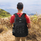 Black picnic cooler backpack worn on back with adjustable straps and front organizer