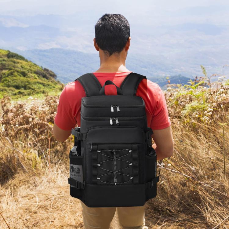 Black picnic cooler backpack worn on back with adjustable straps and front organizer