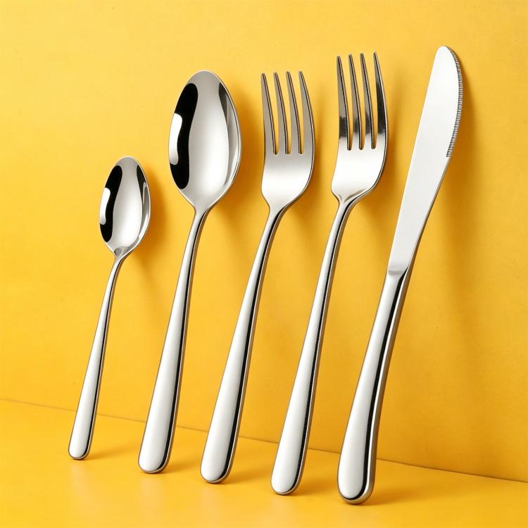 Stainless steel utensil set with spoons, forks, and knife