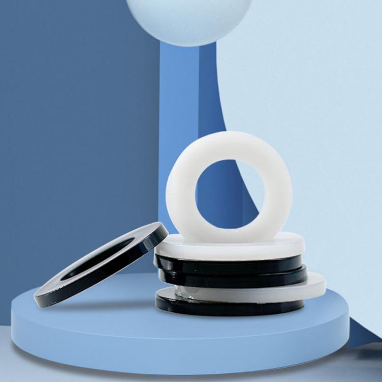 Stacked nylon flat insulating washers, white rings with black grommets