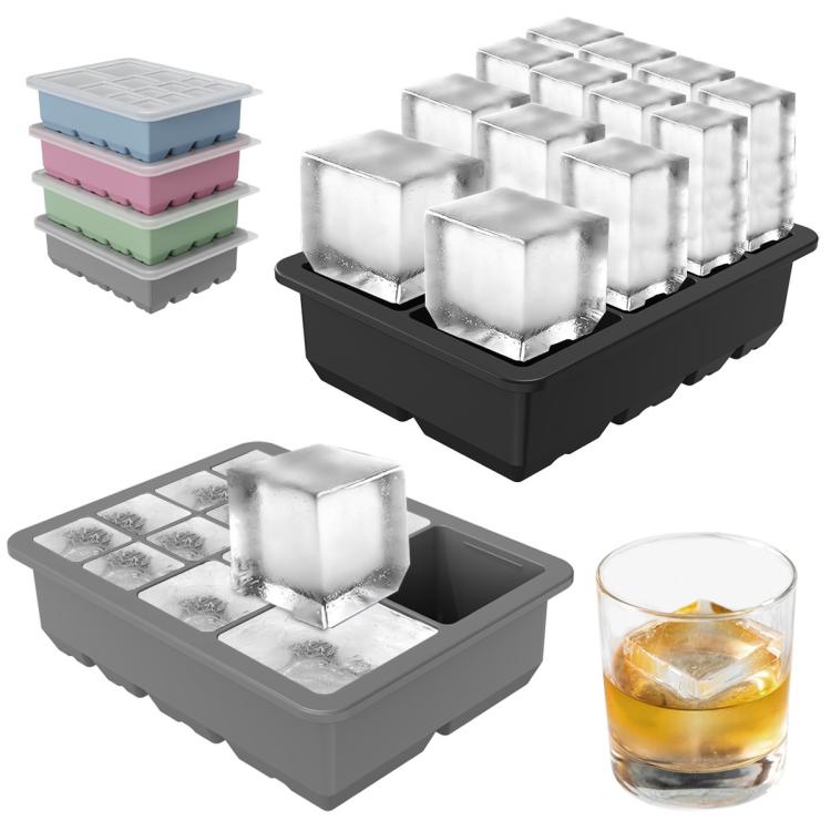 Stacked silicone ice cube trays with ice-filled cubes and a matching lid