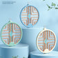 Three folding mosquito zapper lamps in blue and khaki colors on stacked display stands