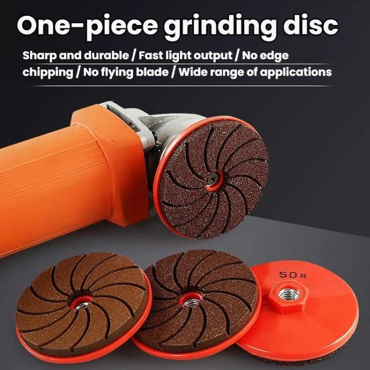 Dark brown grinding discs with threaded centers and an orange angle grinder