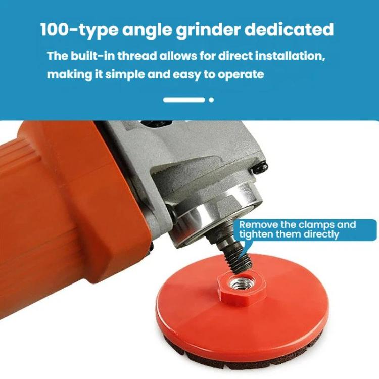 Red grinding disc with threaded center mounted on an angle grinder