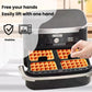 Silicone waffle baking liner being lifted in an air fryer basket, showing baked waffles