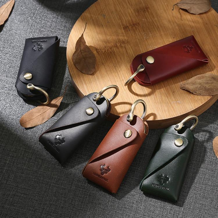 Set of leather key pouches in green, black, brown, and red with metal keyrings