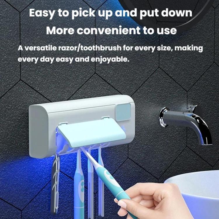 White toothbrush sanitizer stand with blue UV light as a hand places a toothbrush