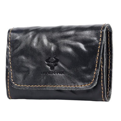 Black leather credit card wallet with front flap, stitched edges, and embossed logo.