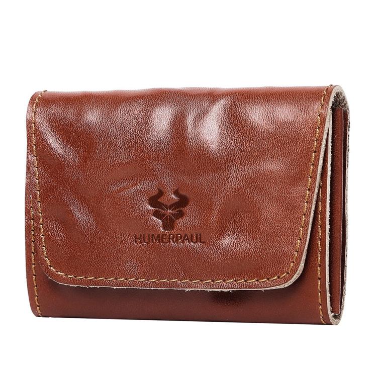 Light brown leather credit card wallet with front flap, tan stitching, and embossed logo.