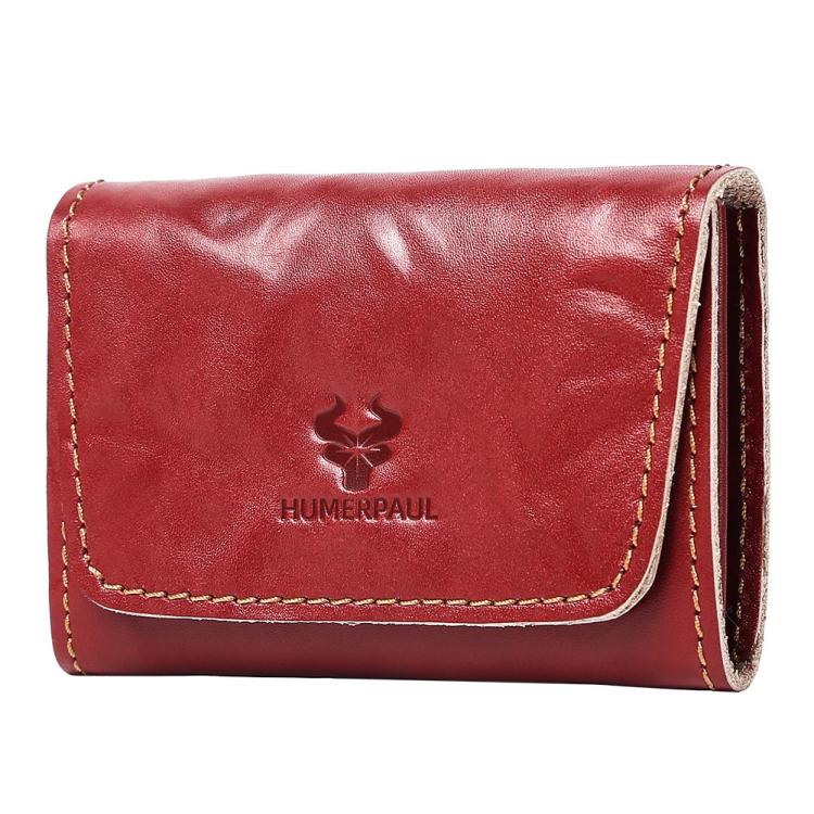 Red leather credit card wallet with front flap, tan stitching, and embossed logo.
