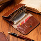 Brown leather wallet opened to show card slots and coin pouch interior.