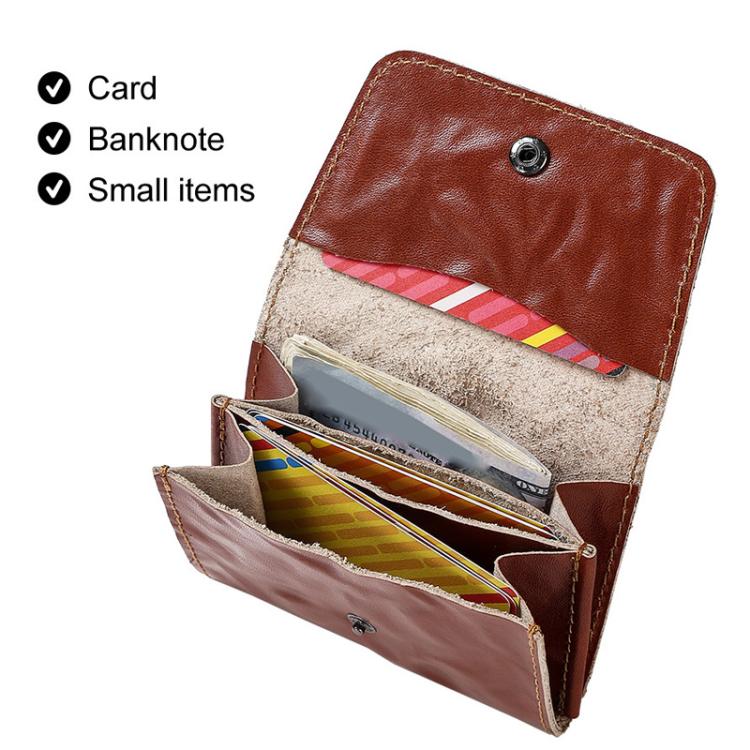 Opened brown leather credit card wallet with card, banknote, and small item compartments.