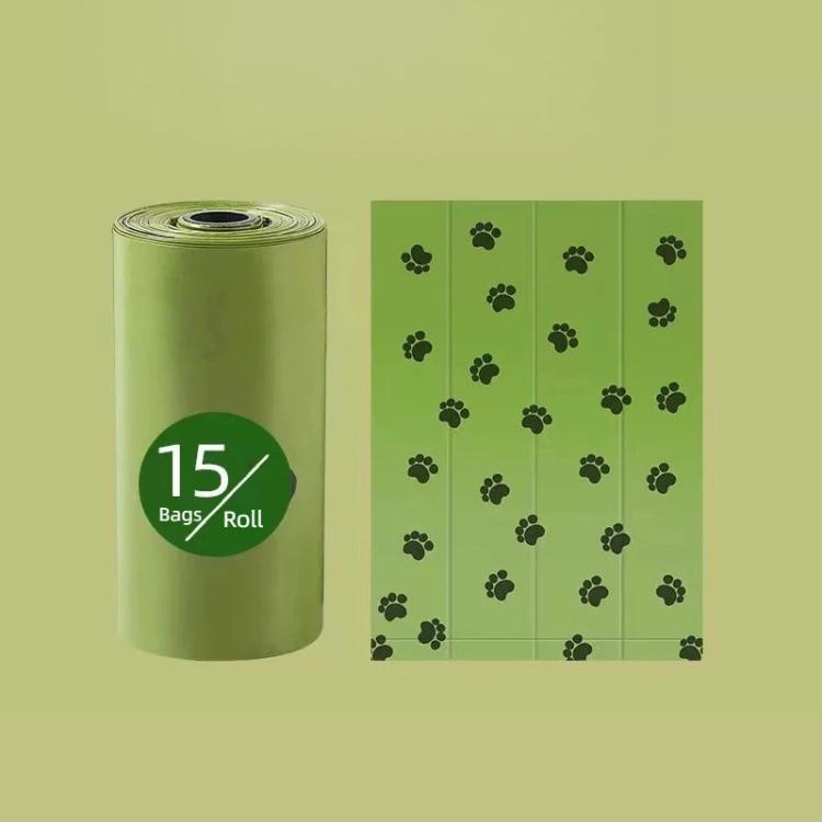 Green dog poop bag refill roll with paw-print pattern, 15 bags per roll