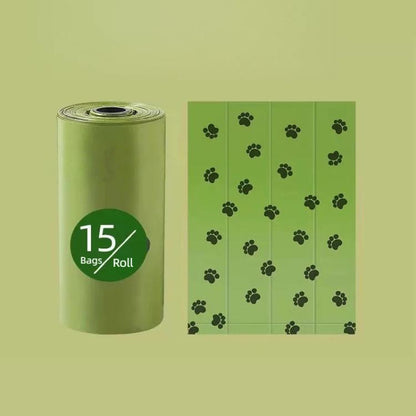 Green dog poop bag refill roll with paw-print pattern, 15 bags per roll
