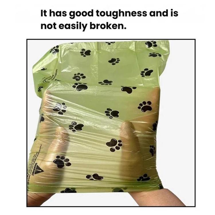 Green paw-print poop bag shown in hand, tear-resistant design