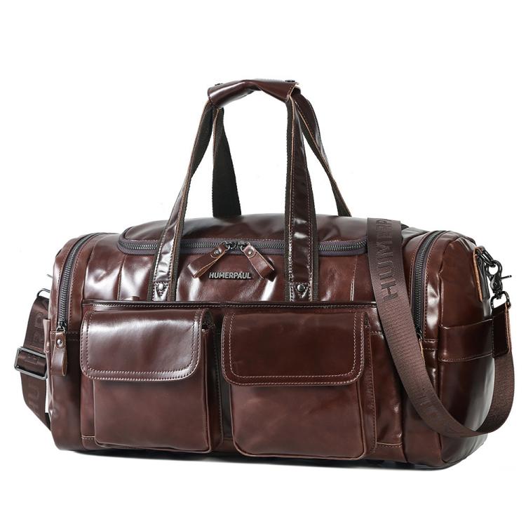 Brown leather duffel bag with two front pockets, top handles, and shoulder strap
