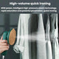 Handheld garment steamer releasing steam onto hanging shirts