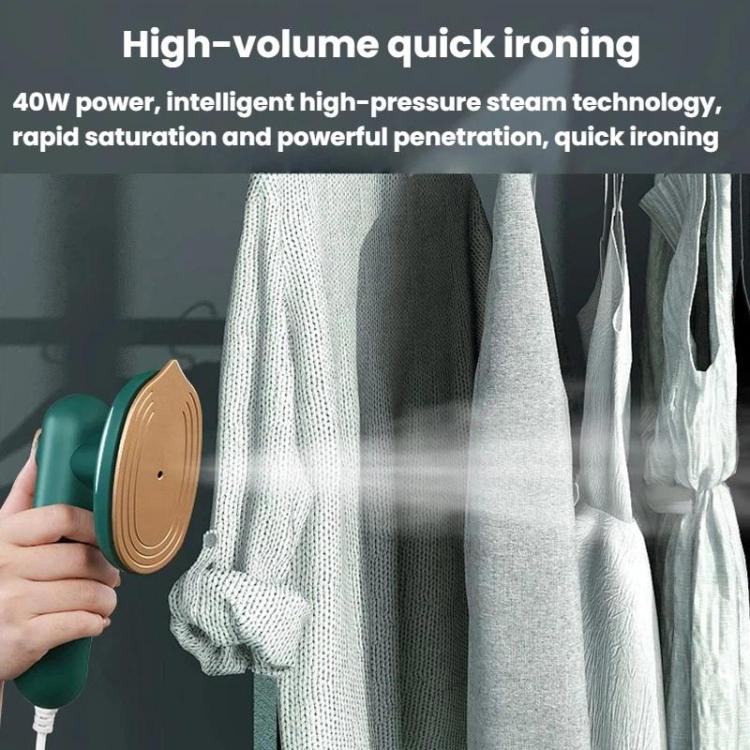 Handheld garment steamer releasing steam onto hanging shirts
