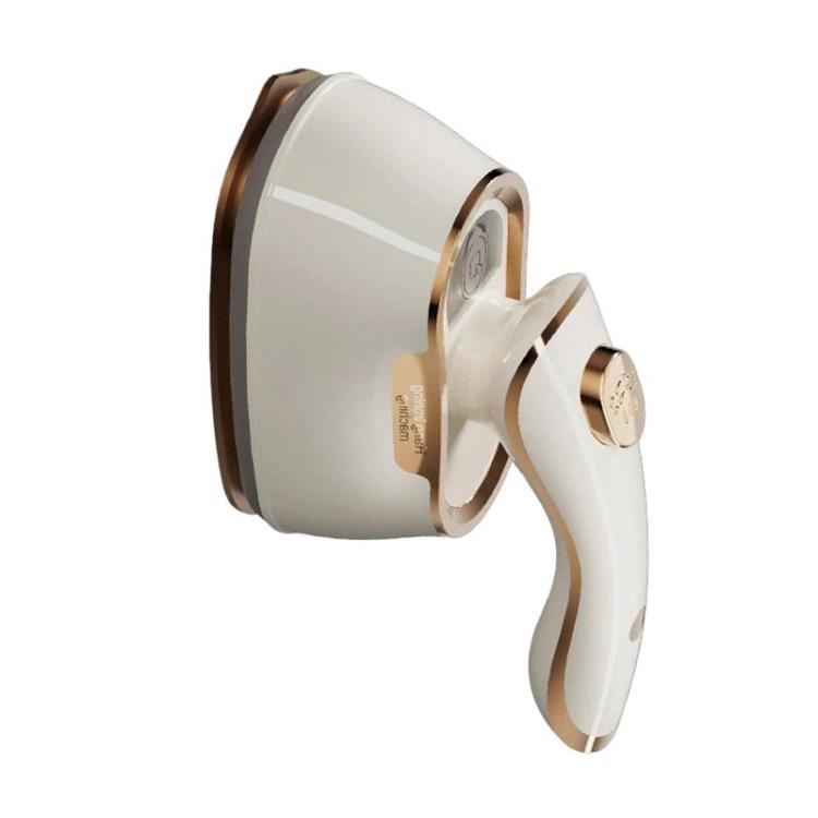 Front view of portable white handheld steam iron with gold accents and nozzle