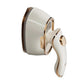 Side view of portable handheld steam iron in white with gold trim and nozzle