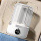 Mini portable washing machine with clear lid and white body, viewed from above