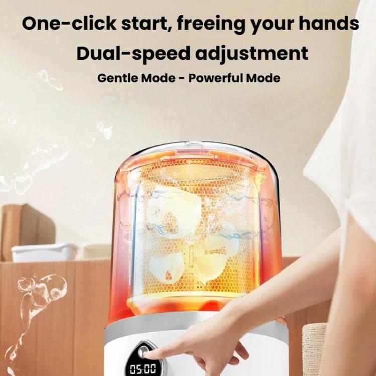 Mini portable washing machine with clear chamber and white base, finger on display
