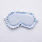 Powder blue faux silk satin sleep mask with ruffle edge and elastic side ties